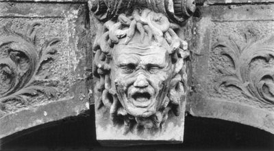 Sculpted head, Schloss Hainewalde, Sachsen, Germany by Simon Marsden